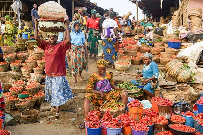 Traders at a bustling local market in Nigeria